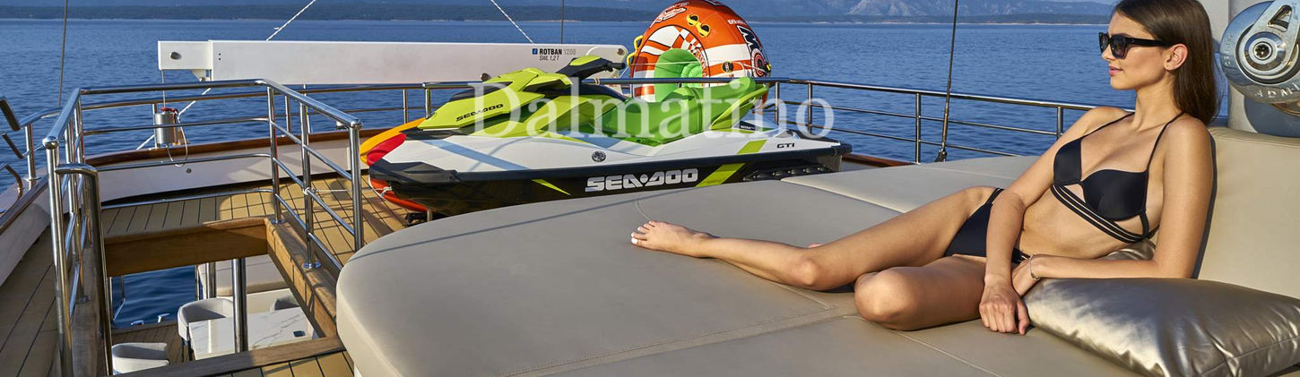 Foredeck sunbathing area with lounge seating and cushions