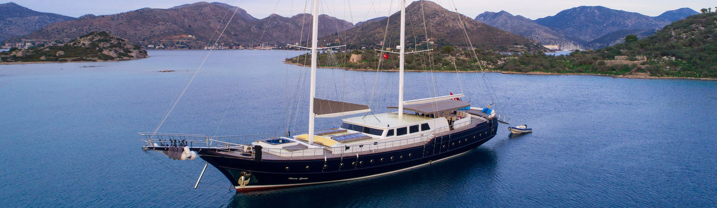 Nevra Queen gulet exterior side view sailing on turquoise Aegean waters