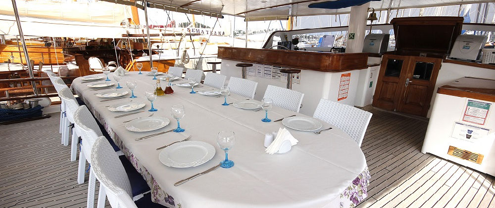 Cemre 4 gulet aft deck dining area on teak deck