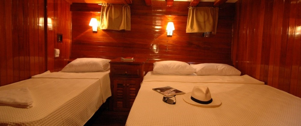 Sunworld 8 gulet triple guest cabin interior with three beds and private bath