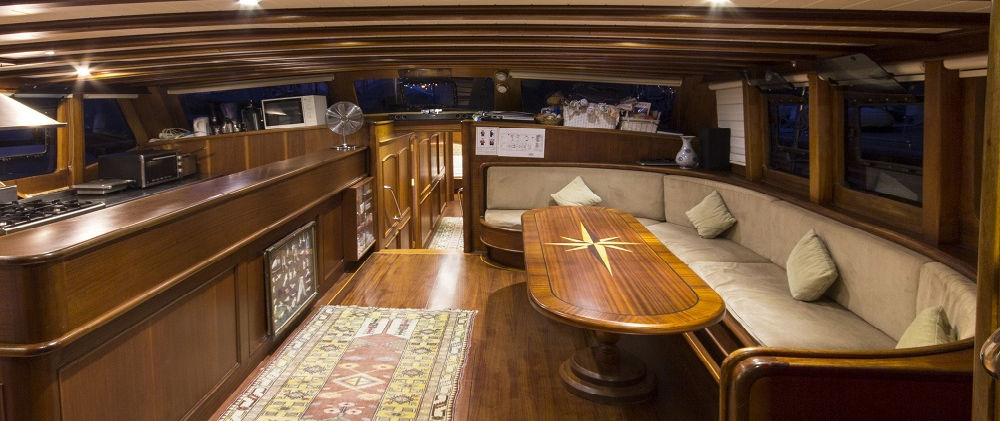 Cemre 4 gulet interior salon lounge with wood finish and seating