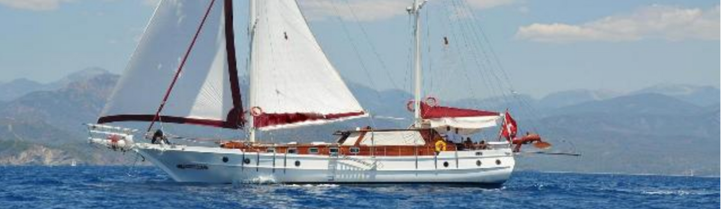 Primadonna gulet exterior side view sailing on Turkish Riviera blue sea