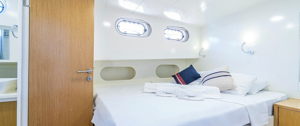 Vamos 1 gulet double guest cabin interior en-suite shower and wardrobe