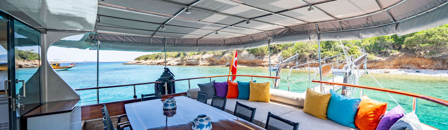 Golden Glory gulet aft deck dining table on teak deck