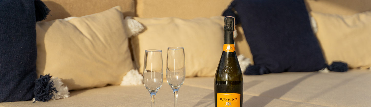 Happy Days gulet aft deck shaded dining table on teak deck overlooking water