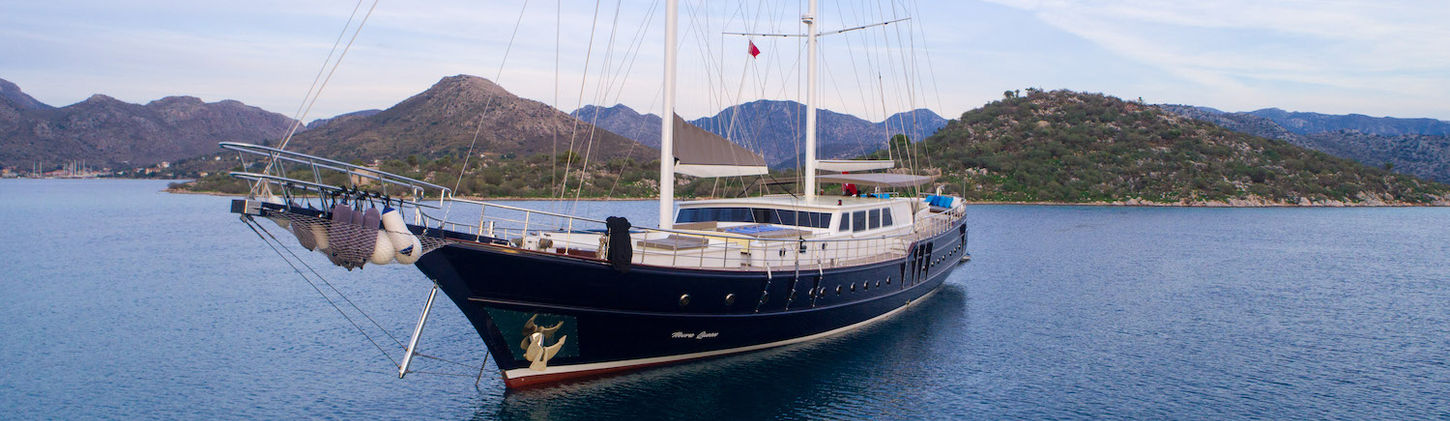 Nevra Queen gulet exterior side view sailing on turquoise Aegean waters