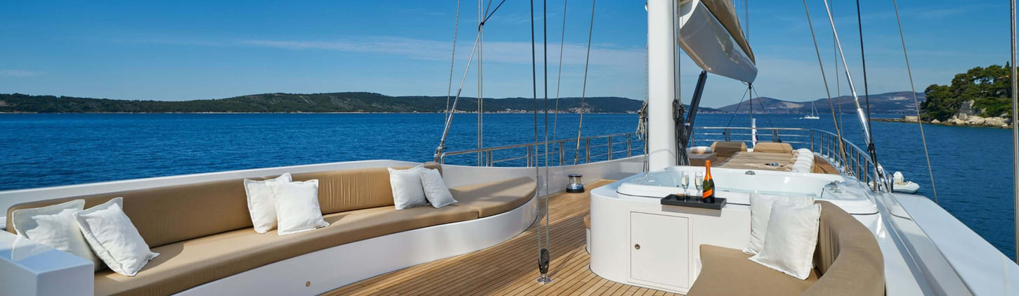 Acapella gulet flybridge jacuzzi and sun-loungers under open sky