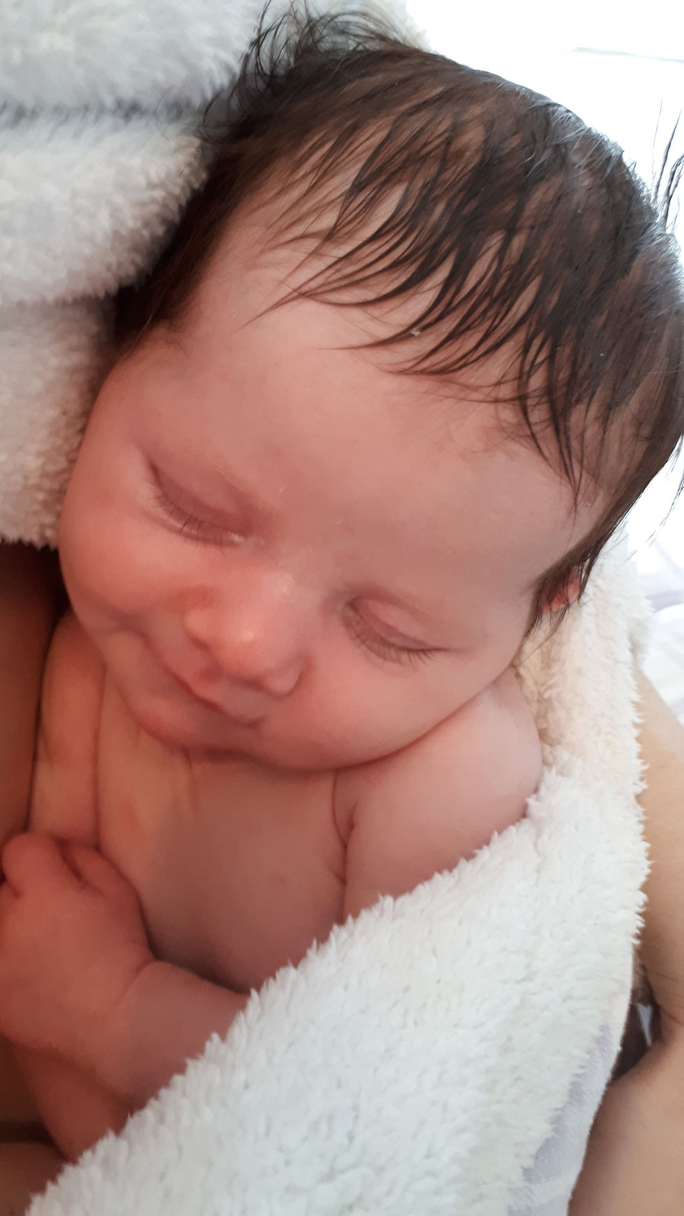 A newborn baby born via an induction birth