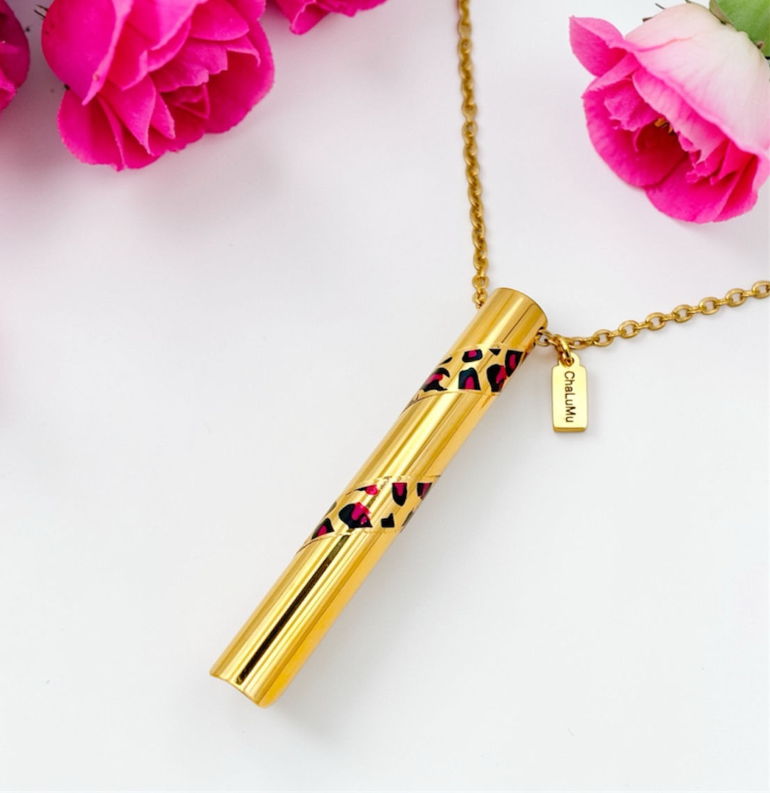 gold plated anxiety relief necklace with hot pink and black design