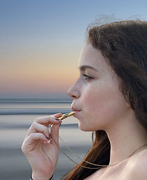 woman showing how to use chalumu breathing necklace
