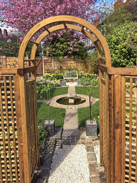 A central arbour surrounded by trellis p