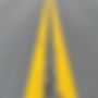 asphalt road with two yellow lines.jpg