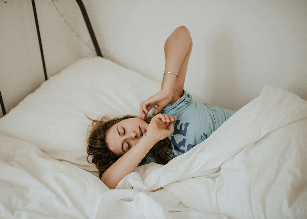 A menopausal woman tossing and turning in bed due to insomnia