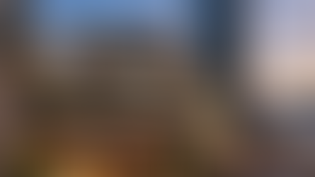 K11 Musea at dawn with the city skyline in view.