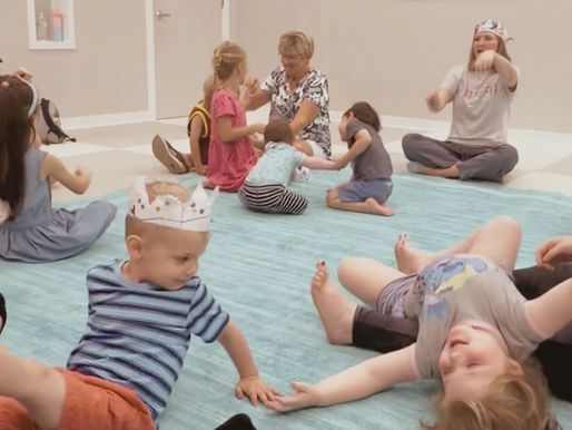 Families enjoying being silly and connecting during a class at Tuneful Journey.