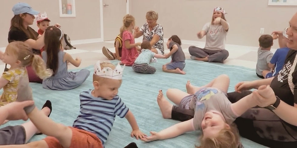 Families being silly and connecting at a Tuneful Journey class.