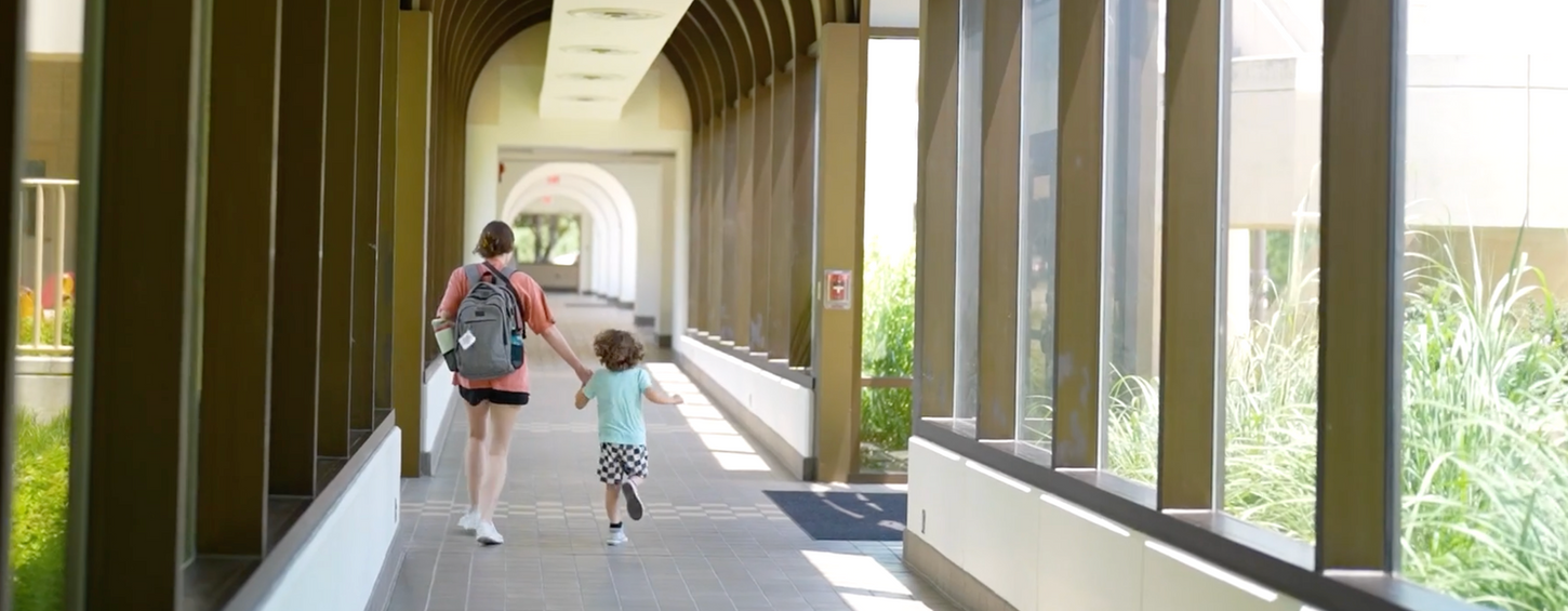 RBT student walking down the hall with a client.