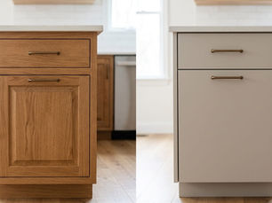 Side-by-side kitchen island cabinets, wood on left and beige painted on right, with brass pulls in a bright modern kitchen.
