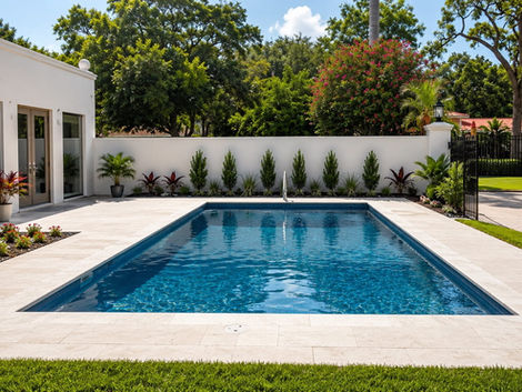 Rectangular swimming pool with patio and modern house