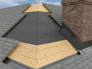 Gray shingled roof with wooden sheathing shows an unfinished section around a red brick chimney under a blue sky.
