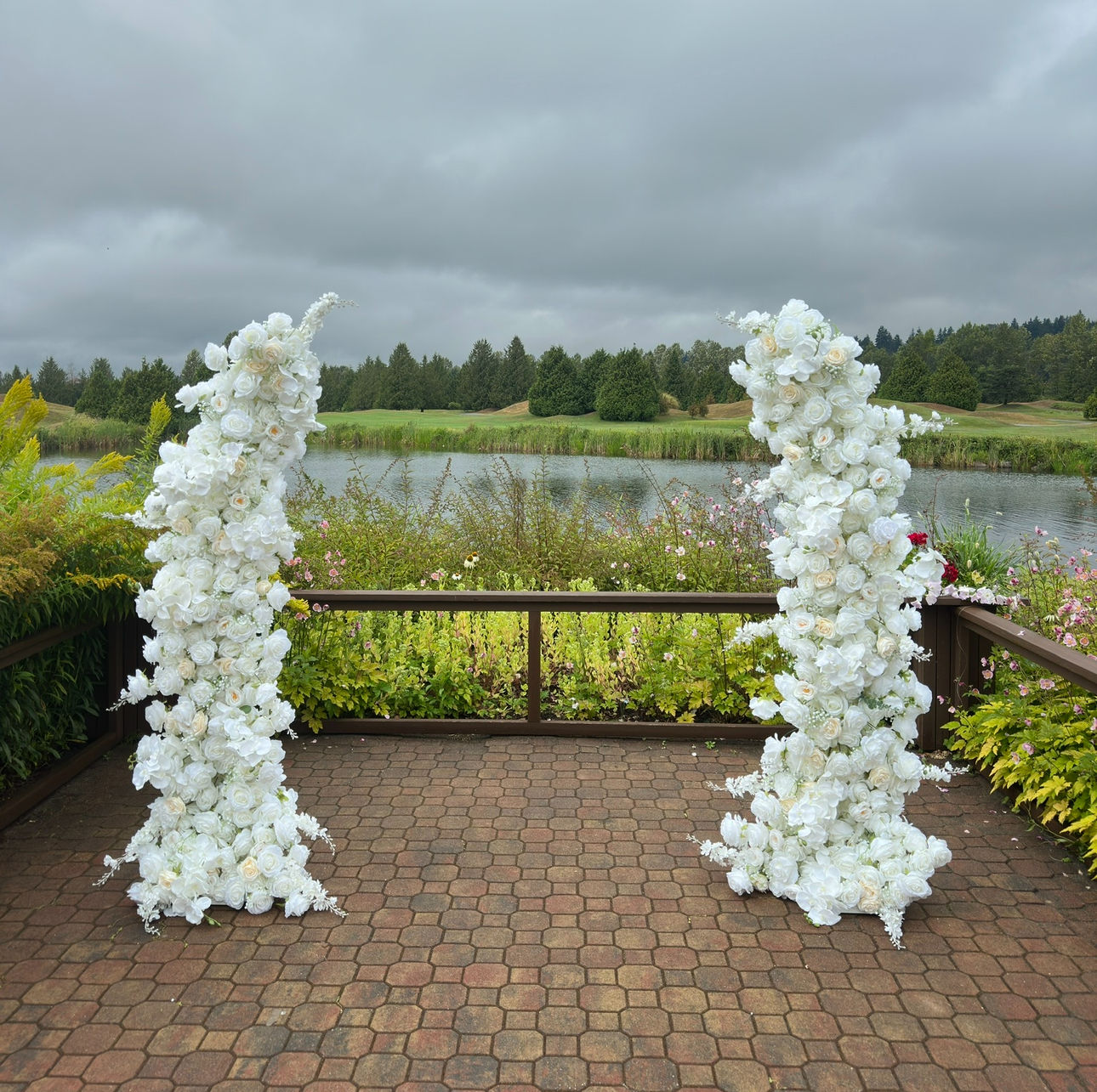 White floral pillars for ceremony
