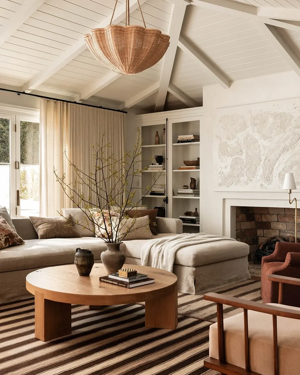  A living room with a mix of browns and new and vintage accessories.