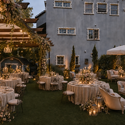 Evening Grande Celebration with round tables and French garden lounges