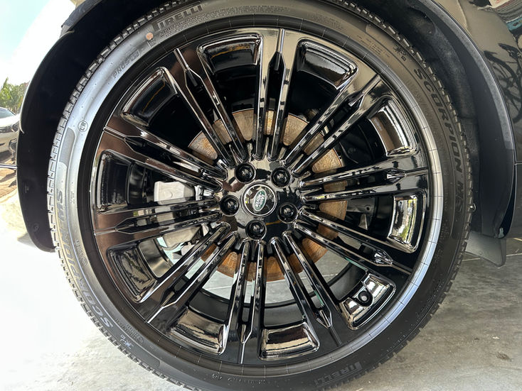 Black car wheel rim detail