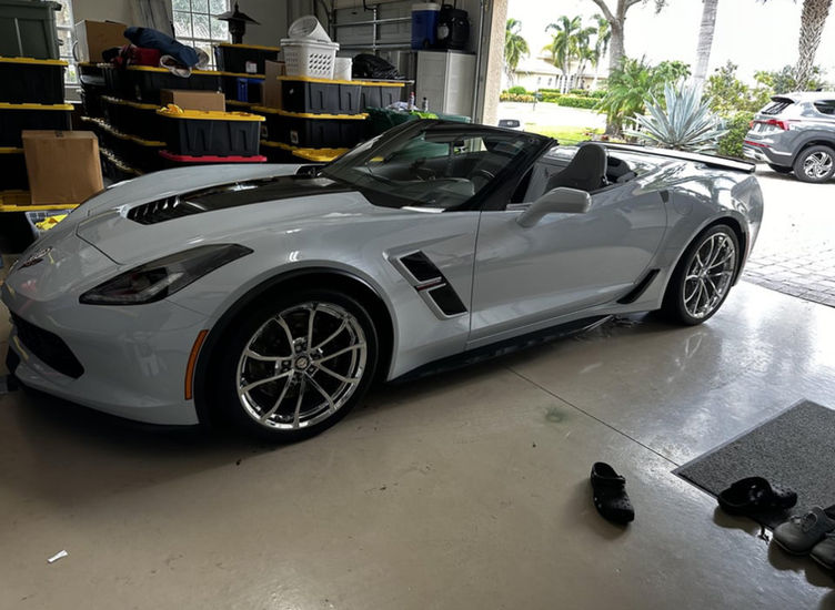 White Corvette convertible in garage