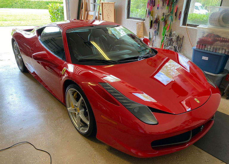 Red Ferrari 458 Italia in garage