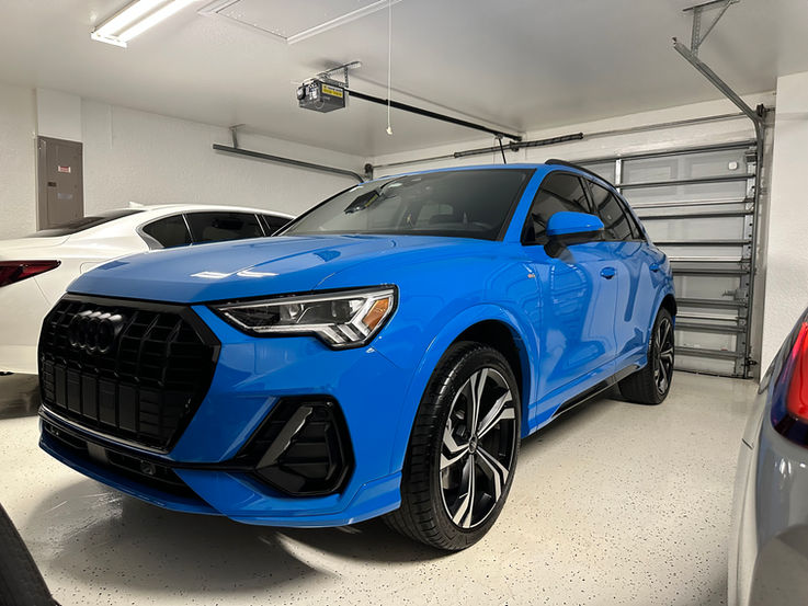 Blue Audi Q3 in garage