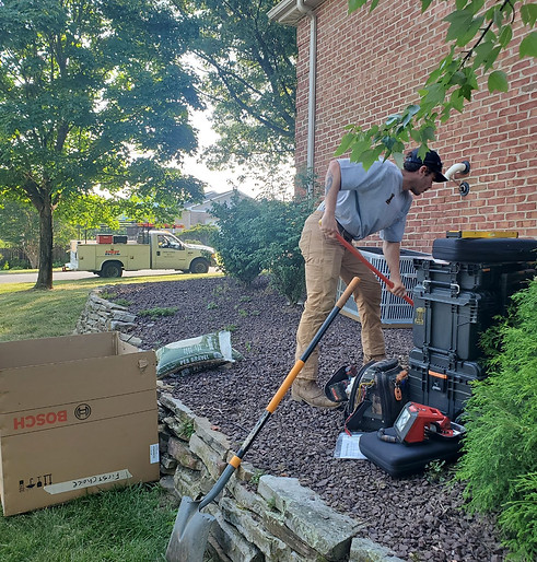 team member working on hvac repair