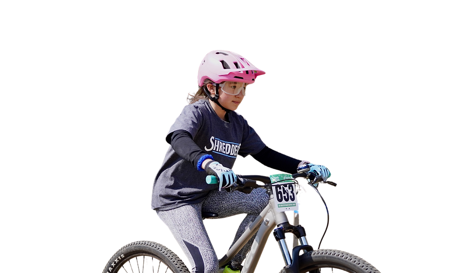 Girl in pink helmet, "Sunshine" shirt, riding mountain bike "653".