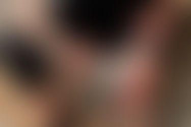 A Photizo Pain Relief red light therapy device being used on a knee