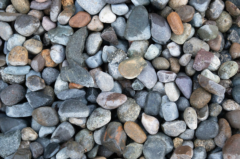 Miniatura: A full-frame photograph of Drainage Rock - Landscape Grade - 3/4" - 1 1/2" Round showing the texture and multi-colors