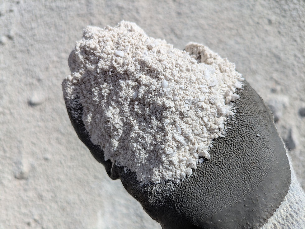 Thumbnail: Closeup of a landscapers hand holding China White - 1/4" Minus