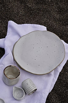 Image showing a diverse collection of ceramic tableware arranged in a visually appealing manner
