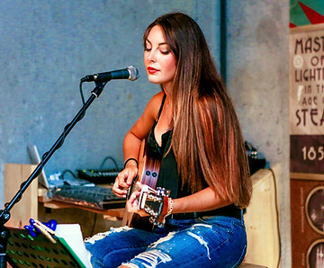 Woman with acoustic guitar