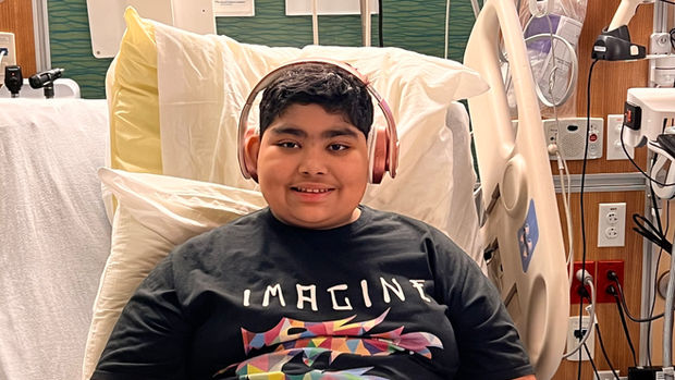 Childhood cancer kid in hospital bed.