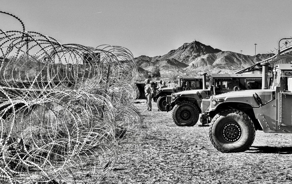 Photograph of the US/ Mexico border.