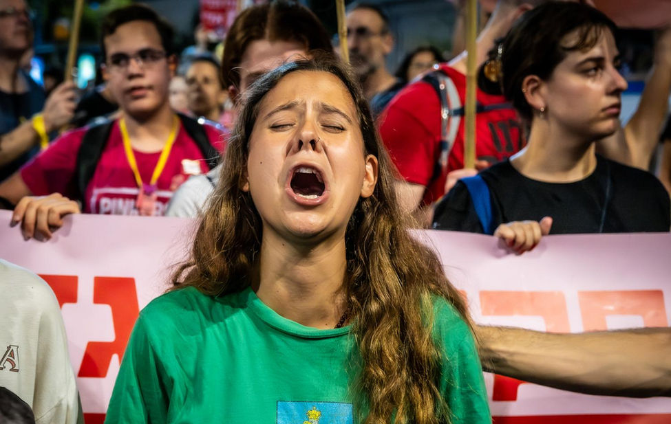 Portrait of a Woman at a demonstration in Israel, photographed by Adar Eyal.
