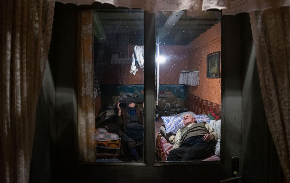 Documentary photograph of an elderly Romanian couple.