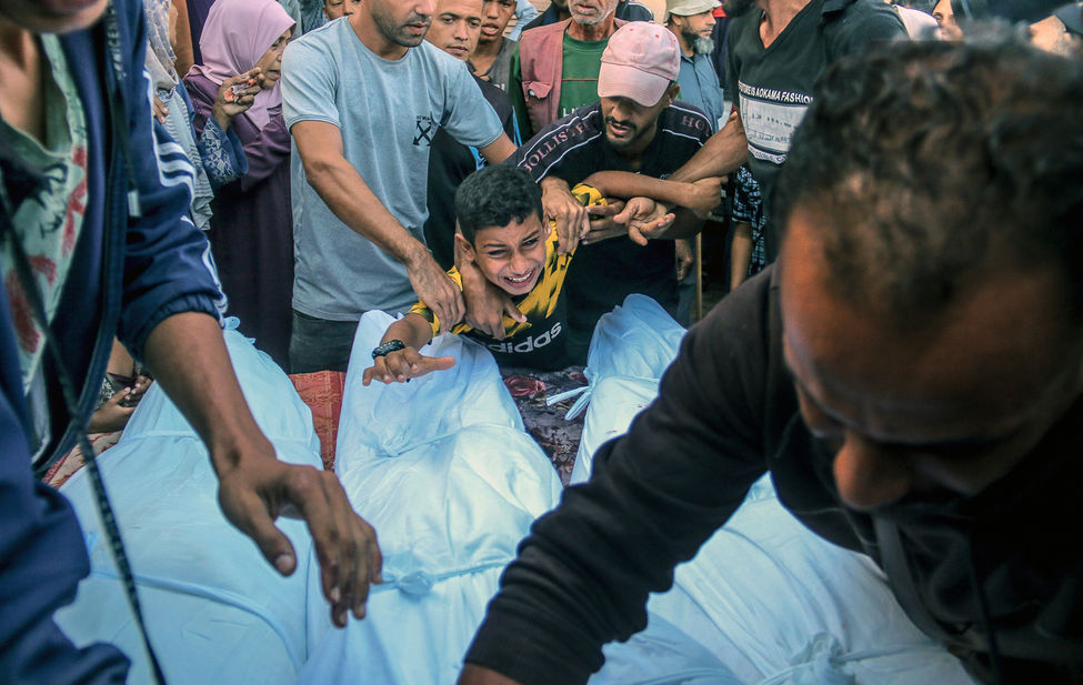 Documentary photograph of a Palestinian child who lost his father and siblings to an Israeli airstrike in Gaza.