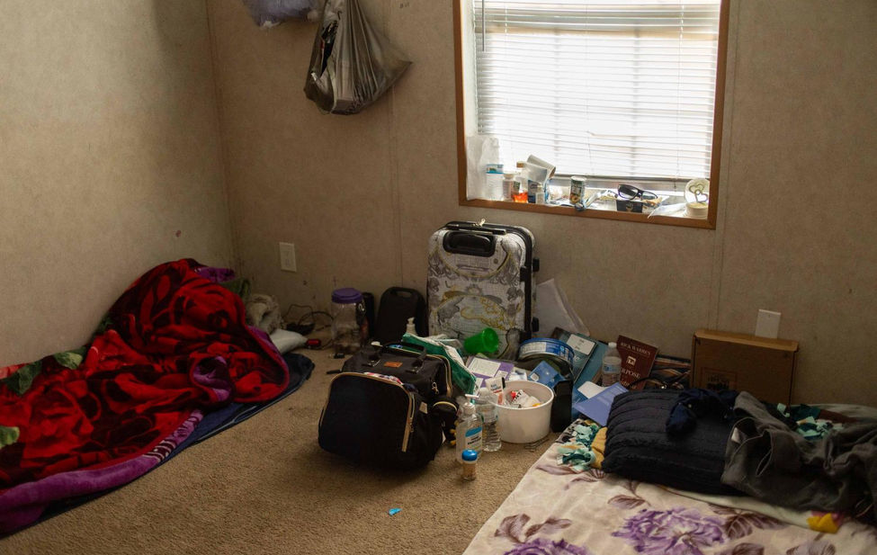 Documentary photograph of a young immigrant mothers bedroom in the United States.