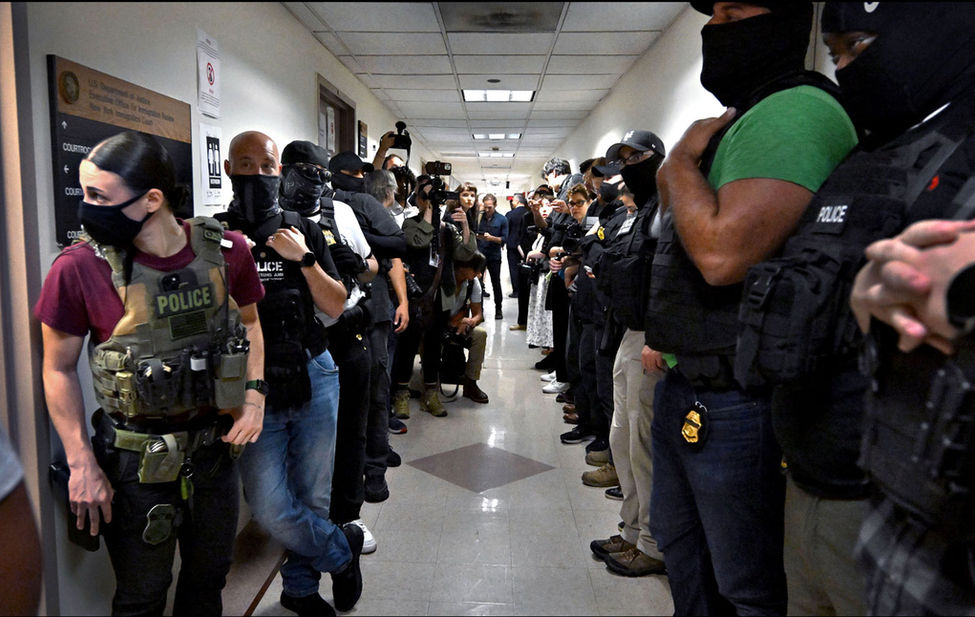 Documentary photograph of ICE deporting people in New York City.