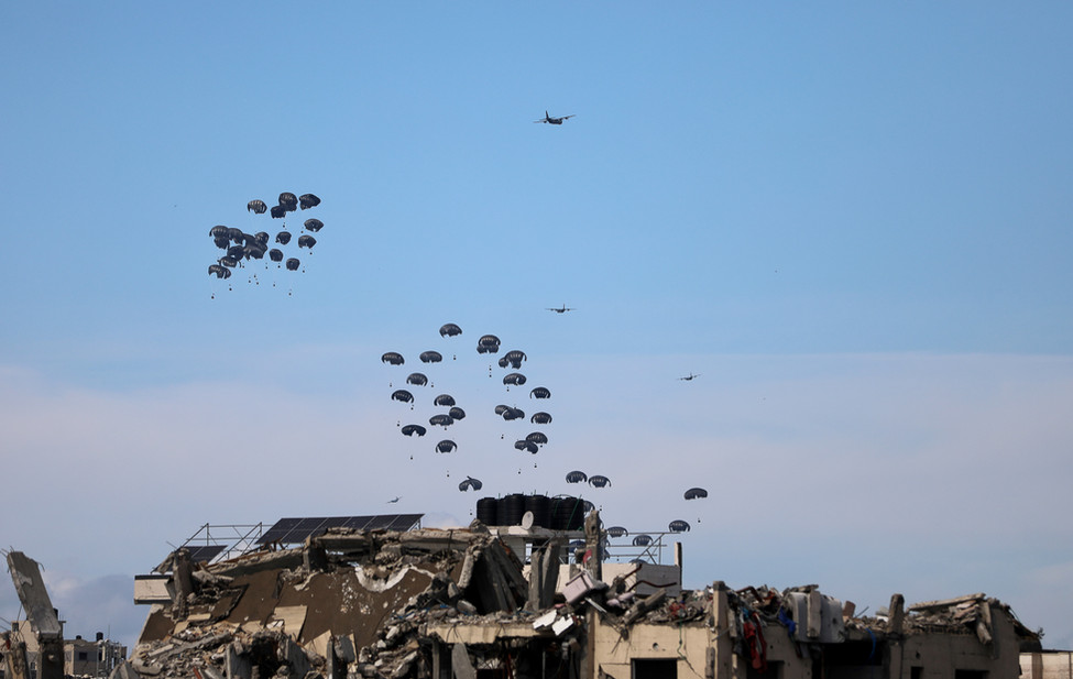 Photograph of planes dropping humanitarian aid in Gaza.