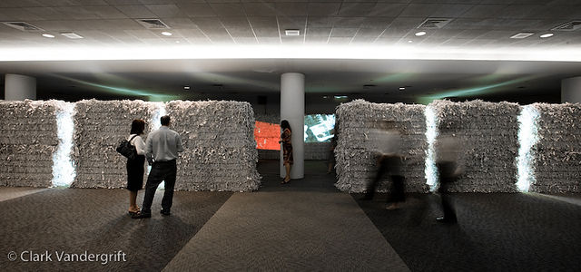 Stacked paper bale art installation with lighting 