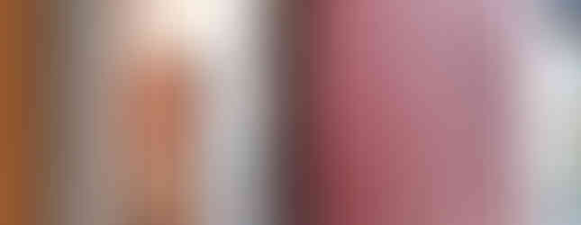 Red fire door in post and beam factory interior