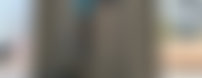 Laser cut and cnc bent modular steel pieces with glass guardrail anchored to steel beam