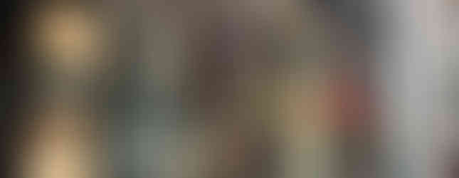 Exterior view glass retail display with white steel laser cut pattern metal panels